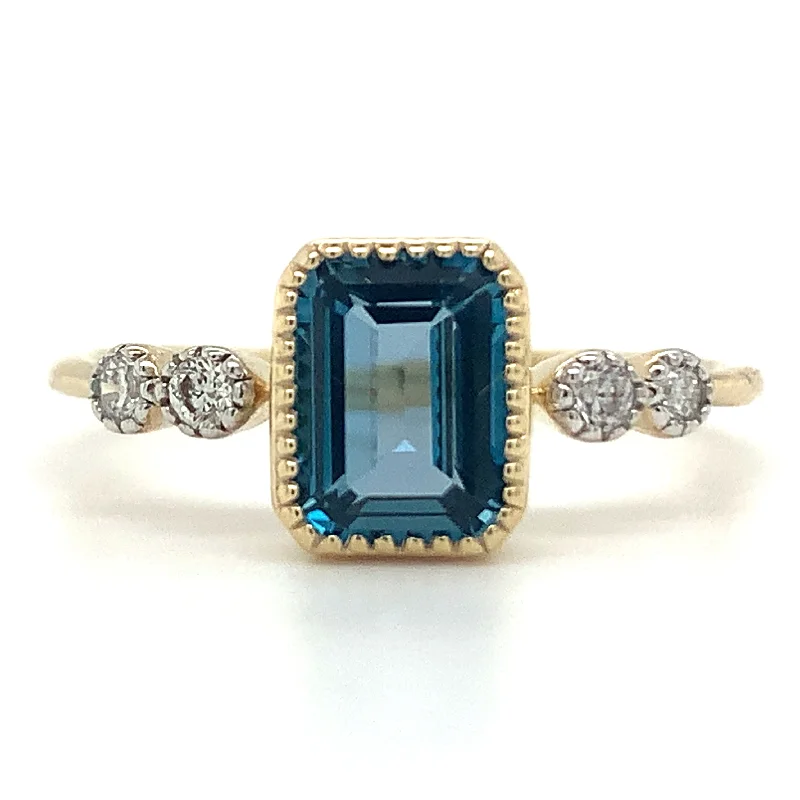 9ct Yellow Gold 1.32ct Emerald Cut London Blue Topaz Ring with Side Diamonds